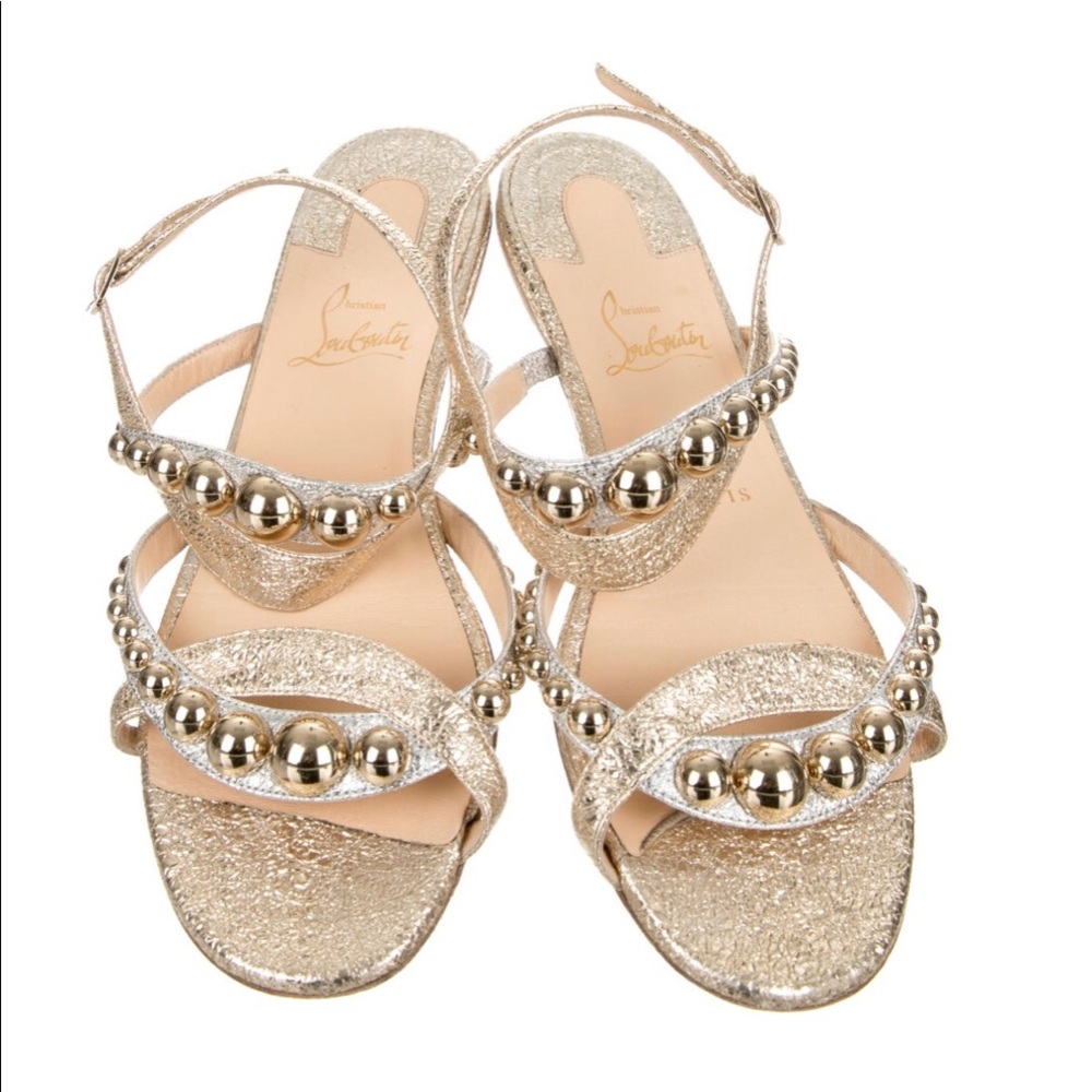 Christian Louboutin  gold flats